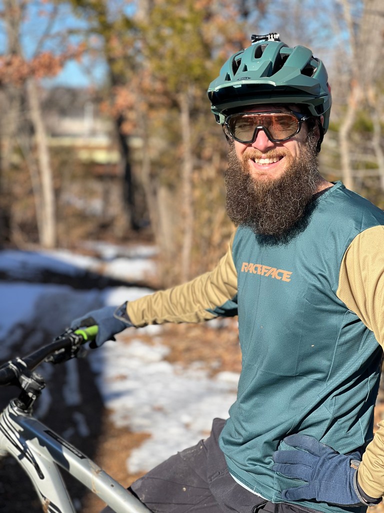Image of the guide and owner of The Local Lap, Kay Burt. He is sitting on his bicycle